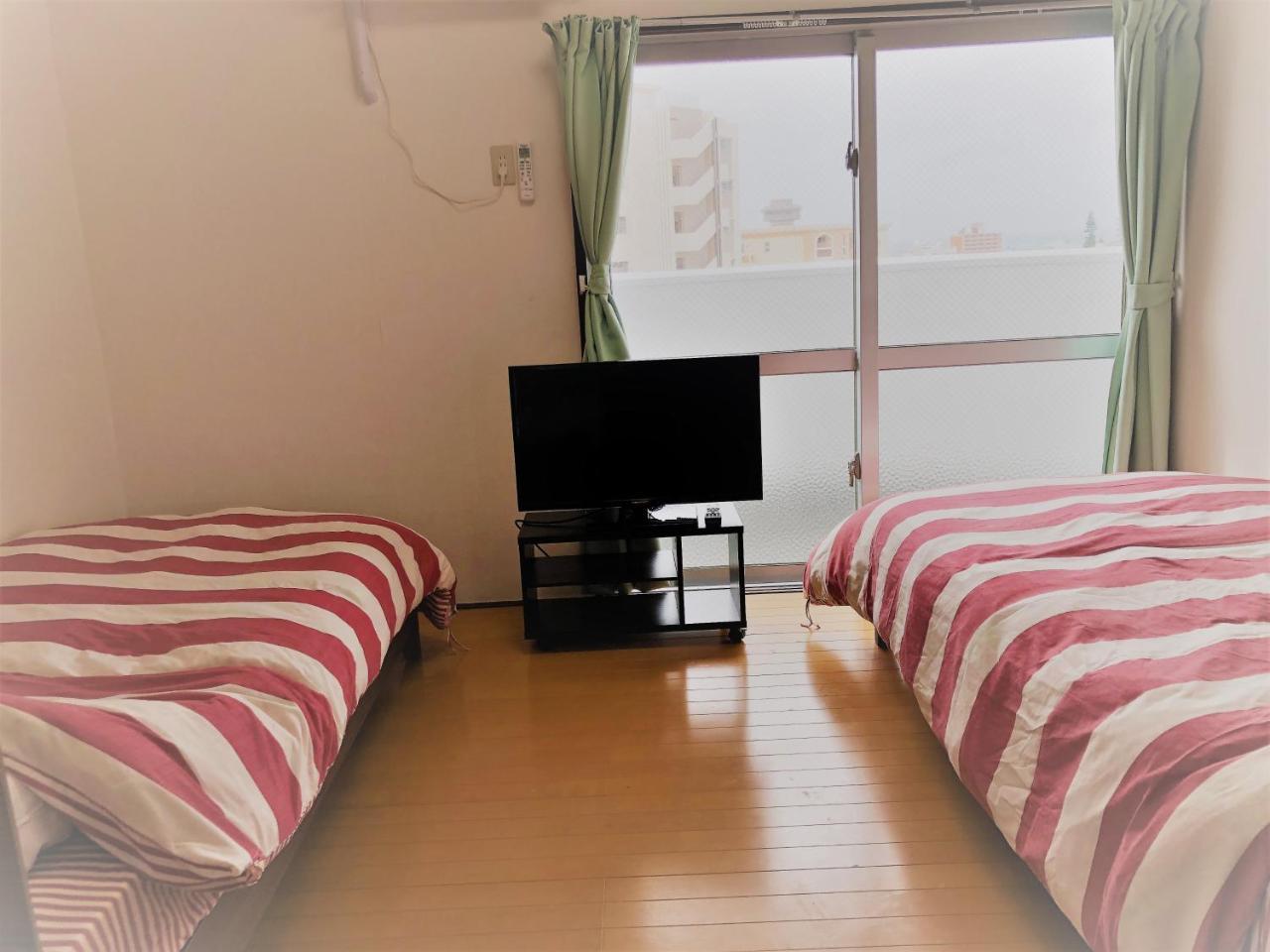 Sunset Hills Inn Naha Extérieur photo